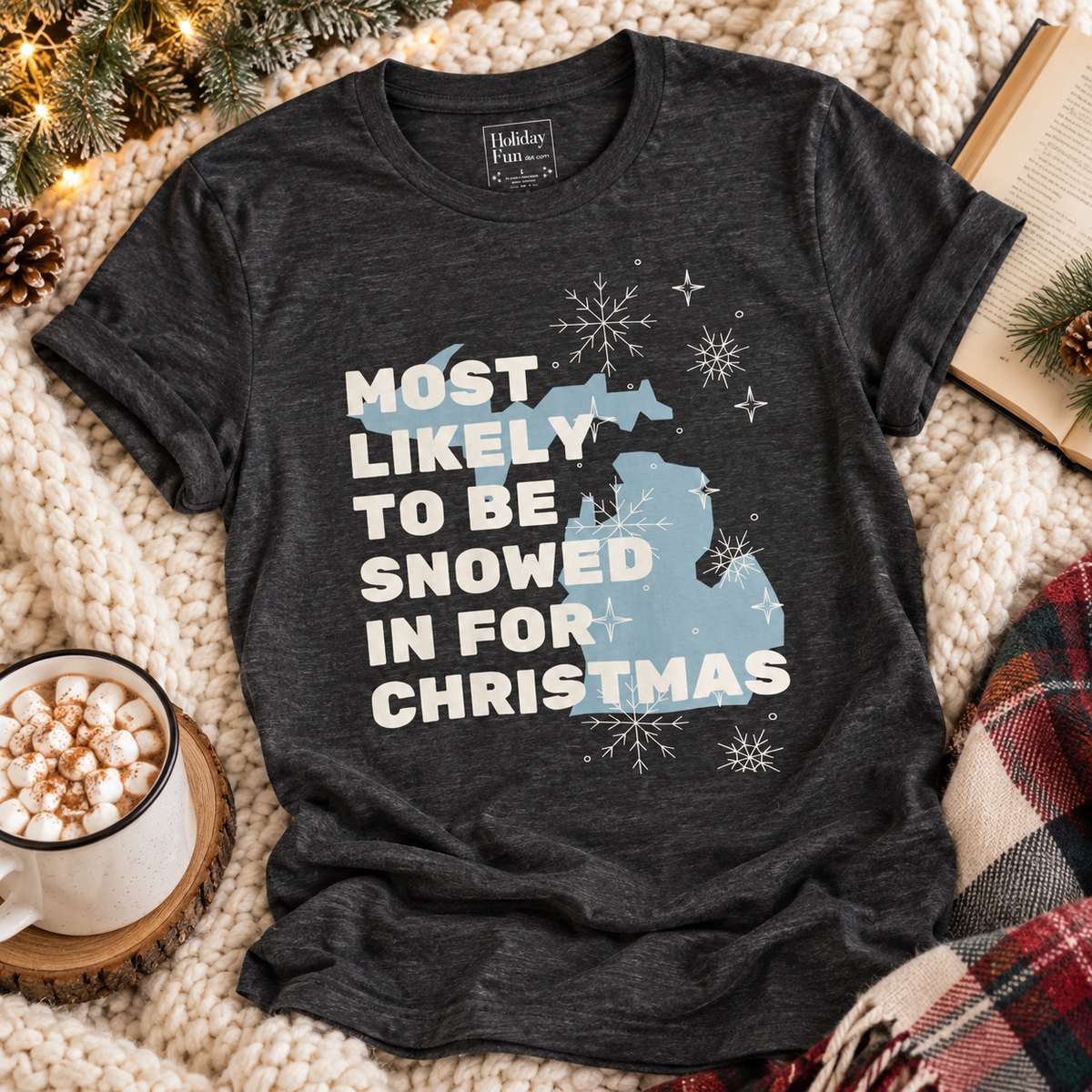 Dark Grey Heather Snowed In for Christmas tee on knit blanket flat lay